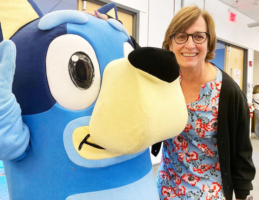 Eilsabeth McGowan, MD, director of the NICU Neonatal Follow-Up Program at Women &amp; Infants Hospital, joins the celebration and birthday party for all those children who were in the NICU in 2020, with Bluey, a character from the animated series for preschool children.