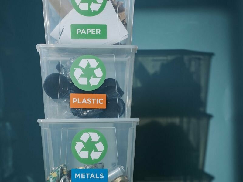 (Photo: Stacked boxes sort plastic waste. Credit: Canva Stock.)  plastic tax legislation