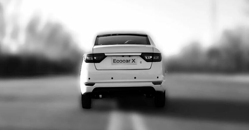 Solar-Powered Ecocar White car driving down a road