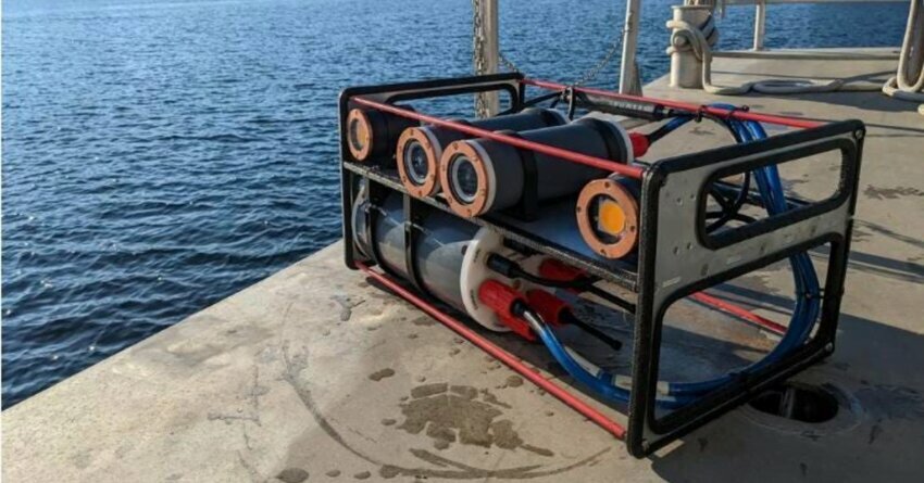 MarineSitu underwater machine sitting on a cement dock near water