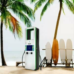 EV Charging Station on the Island of Hawaii. Palm Trees, sand and 4 surf boards.