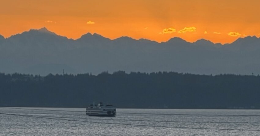 Edmonds scenic Tuesday’s sunset glow. Boat on a river