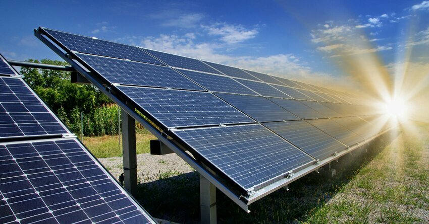 Solar panels are flush against a blue sunny sky. collaborative project