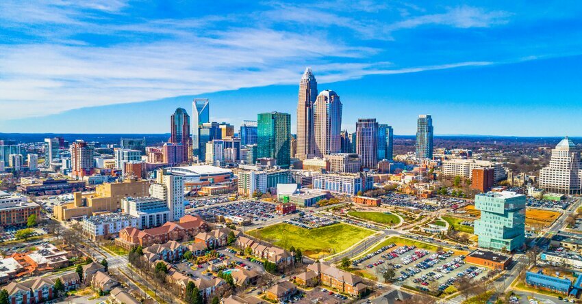 The Charlotte skyline is pictured against bright blue skies. high energy pilot program