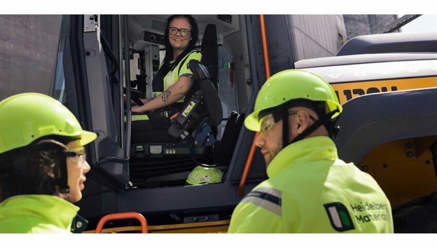 construction workers gather around an EV