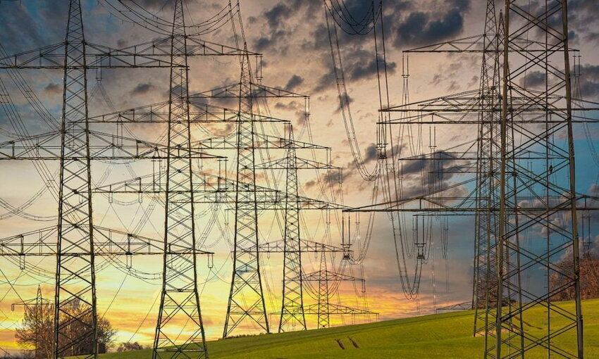 Electricity power lines over a sunset