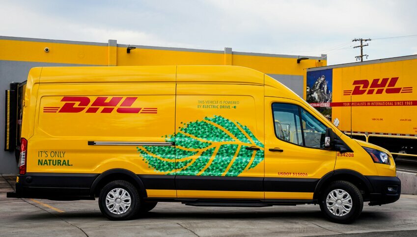 DHL Yellow Electric Fleet Van with Green Leaf printed on side of van