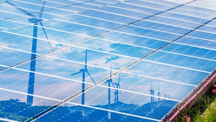 Solar panels with wind turbines reflecting on them