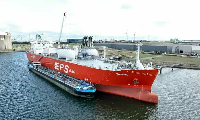 Red cargo ship on water