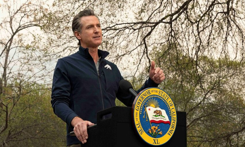 Governor Newsom, California governor, speaking at a podium