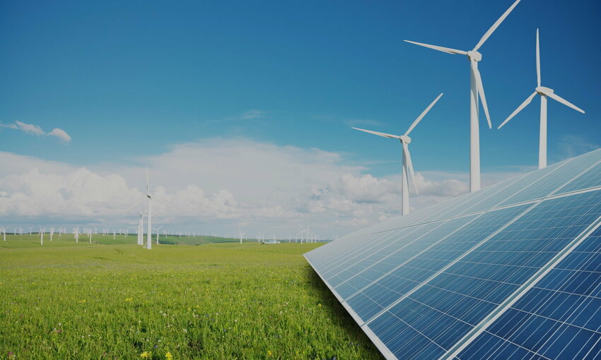 Solar panels and wind turbines in a field