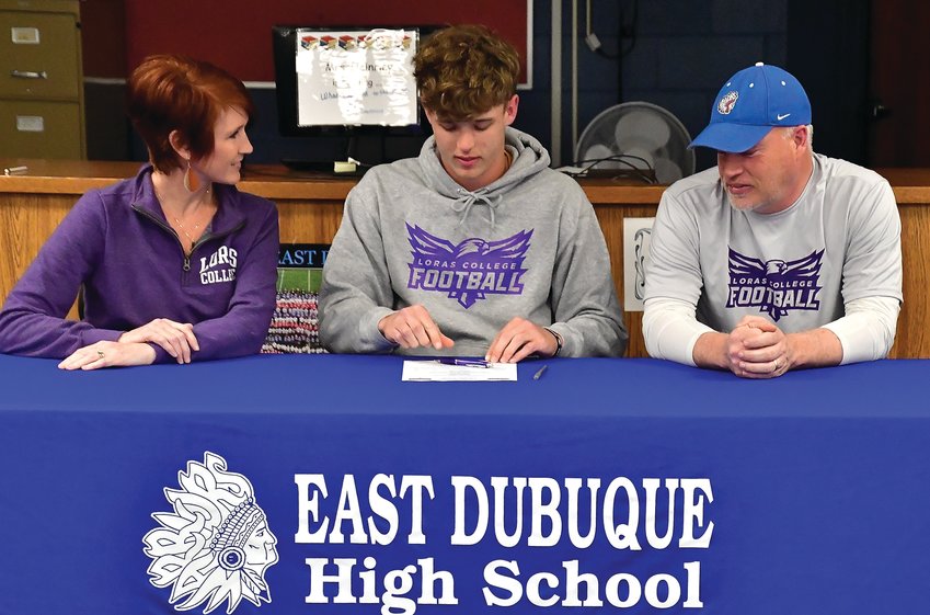 East Dubuque senior Sam Bowman held his signing day on May 6 at East Dubuque High School. Bowman signed to play football at Loras College. Pictured are Stacy, Sam and Don Bowman.
