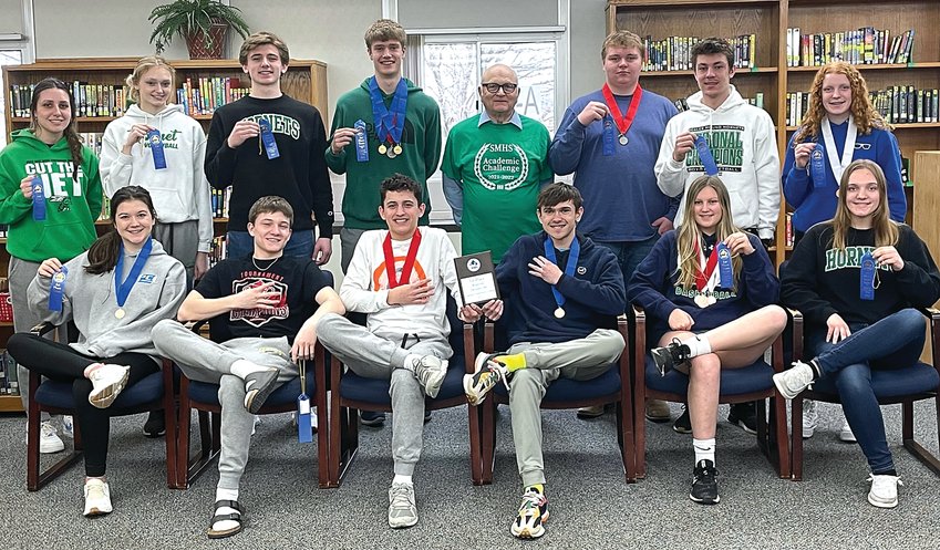 The 2021-2022 Scales Mound Academic Challenge team recently completed a successful season, members of the team are: back row, from left: Amanda Withington, Kennedy Kudronowicz, Sam Cocagne, Benjamin Vandigo, Coach Keith Hesselbacher, Mitchel Travis, Jacob Duerr, Anna Wentz; Front row: Anna Cogan, Evan Cogan, Charlie Wiegel, Isaac Heffernan, Jaidyn Strang and Emma Wentz.