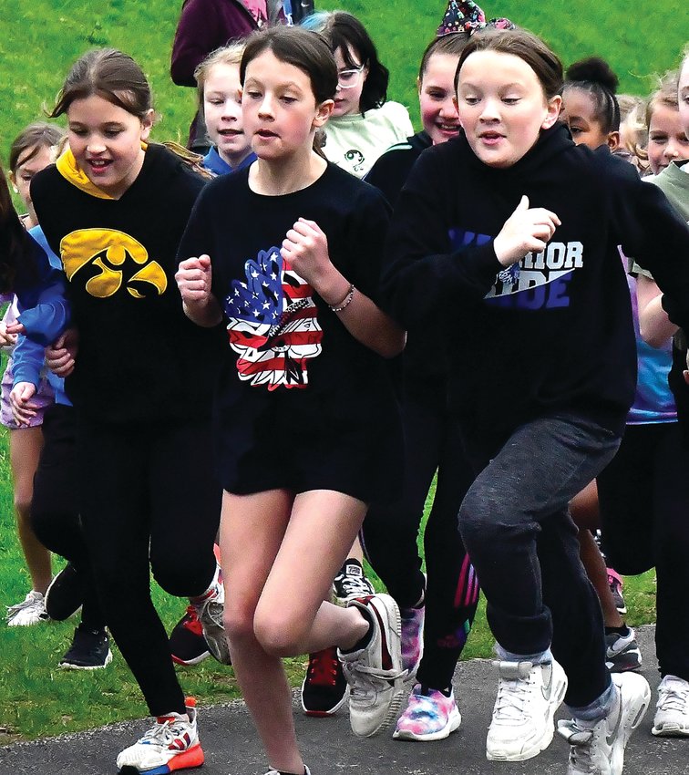 East Dubuque students Aubree Knaeble, Ireland Doyle and Natalie VanOstrand take off at the start of the Bunny Hop.