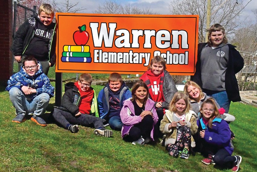 Warren Elementary School received a donation from Acciona Energy for a new sign. Pictured are members of the Warren third grade class: back row, from left: Gabe McKee, Gavin Miller; Front row: Christian Wernimont, Owen Kohl, Tanner Thompson, Madison Siergiej, Max Brinkmeier, Piper Blanchard, Genevieve Stocks and Alyssa Albrecht.