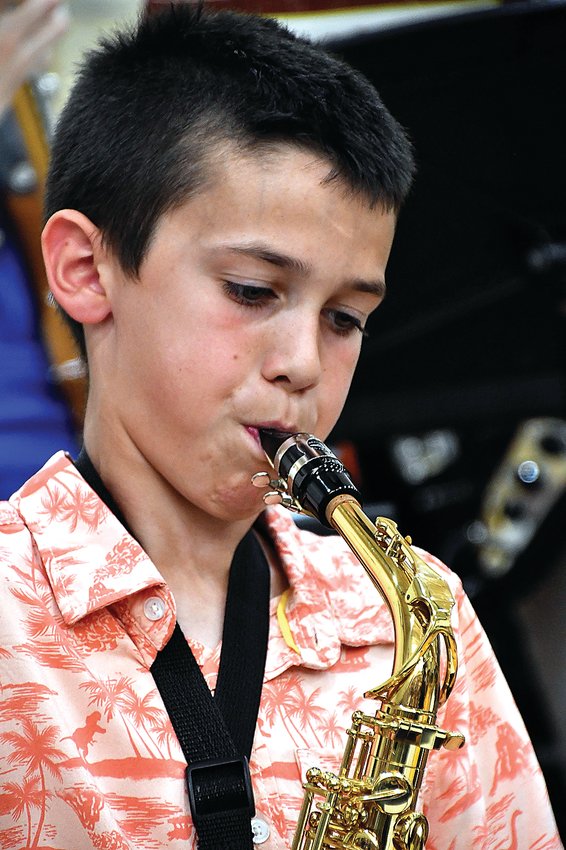 Vincent Gullone plays the saxophone during the Galena Middle School band concert held on May 12 at the Galena High School gym.