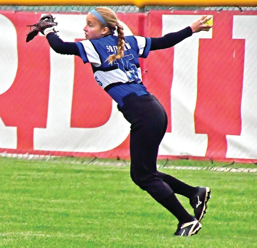 Southwestern center fielder Lucy Freiburger throws a ball to the cutoff during the Wildcats&rsquo; 9-6 loss to Highland in the WIAA regionals.