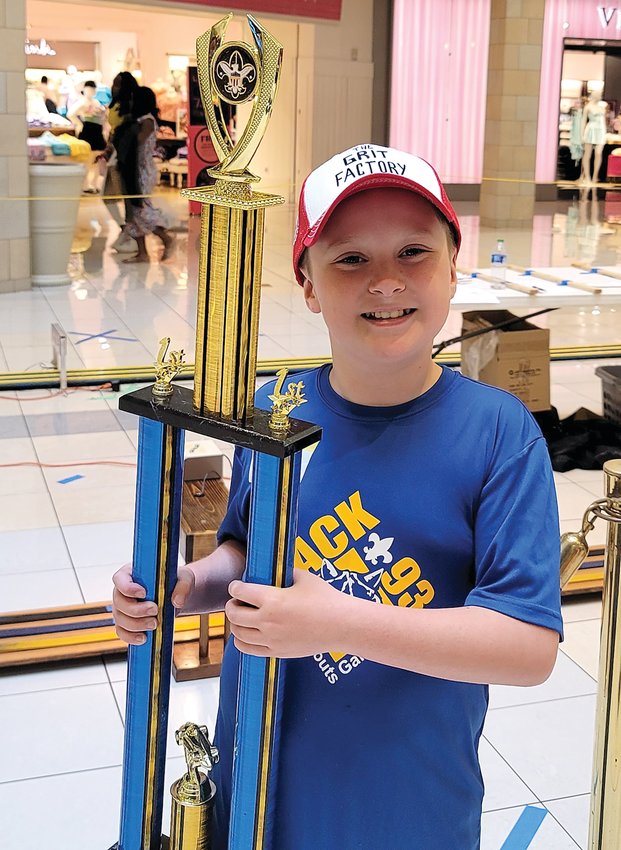 Landon Heim won 1st place in the Bears (3rd grade) division at the 2022 Blackhawk Area Council Pinewood Derby at the Cherry Vale Mall in Rockford on May 1 after winning his age group at the local Pack 93 races in Galena in February. Heim, Billy Bookless, Royce Houy, and Cooper Lane all represented Pack 93 from Galena at the event this year.