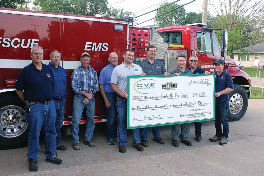 Menominee-Dunleith Fire Department received a donation in the amount of $411,751 to be used towards a new fire truck. Pictured are, from left: John Williams, Joe Deckert, Nick Tranel, Bob Wallenhorst, Jason Lange, Brian Houtakker, Carl Steien, Brad Averkamp and Cal Cain.