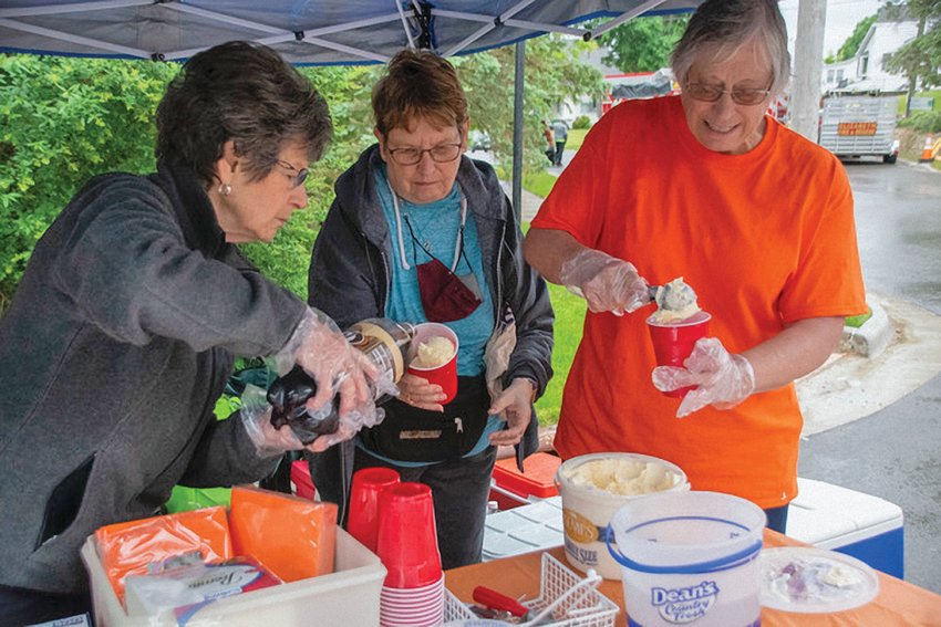 The Spring Fling sponsored by the Elizabeth Chamber of Commerce held events on Main Street in Elizabeth on June 4. Above: Judy Wilson, Norma Schwirtz and Kay Bailey dish up root beer floats.