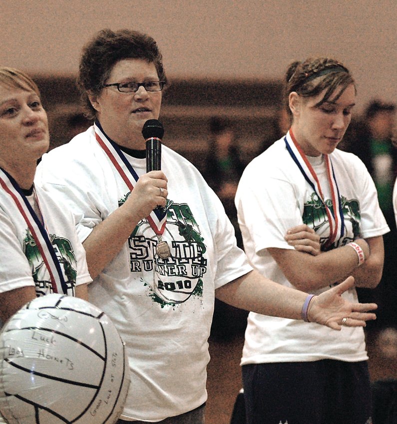 Angie Winter, center, addresses a crowd of Hornet supporters during the 2010 Hornet volleyball state run. Winter, the head coach of the team, passed away on May 22 at the age of 53, after a 23-year battle with cancer.