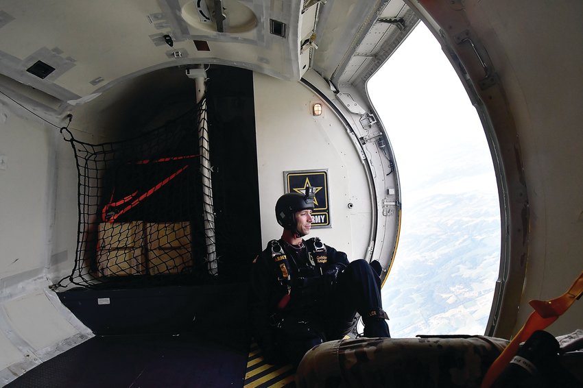 SFC Raine Fuller of the United States Army Golden Knights Parachute team looks over Dubuque as he prepares to jump on July 2, 2021.