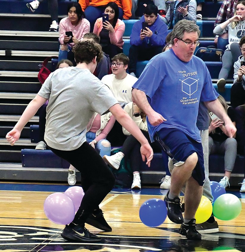 Galena High School science teacher Greg Tancrell avoids having his balloon stomped by Galena freshman Josh McNett during Galena High School Key Club&rsquo;s balloon stomp event on Thursday, April 14. The student with the last remaining balloon won a $20 gift card to Adobo&rsquo;s.