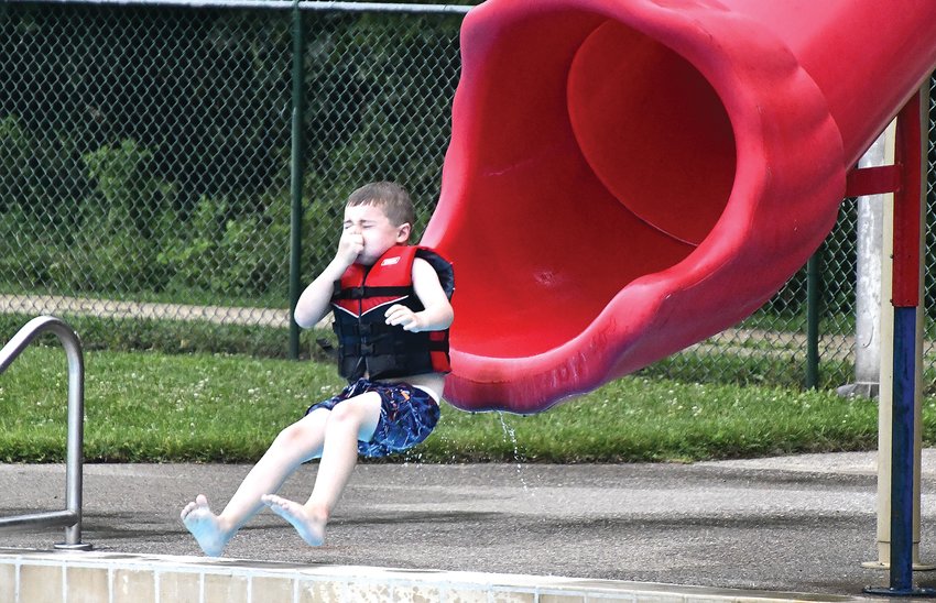 After going down the slide, Emmett Zell is all ready to get wet during Fun Night at the Alice T. Virtue Pool on Friday, July 15.