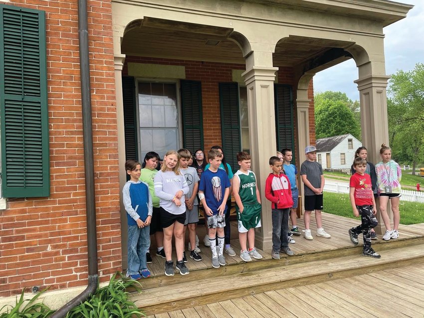 There&rsquo;s a historic photo of U.S. Grant standing on the front porch of his home on Bouthillier Street. These students from Scales Mound got a chance to stand at the same spot. From left, Aaron Gross, Raelynn Redfearn, Austin Distler, Mitchell VanRaalte, Adam Gross, Leo Wilhelm; second row: Carson Schuhart, Augie Hesselbacher, Steven Howard, Emma Alvarez, Evy Plath, Summer Goebel, Ian Stadel, Weston Stoewer, Riley Anderson and Elliana Wiederholt.