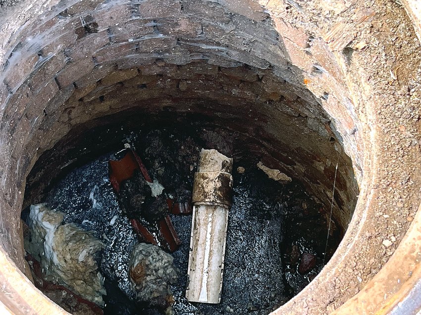 A manhole on Dodge Street shows some wipes that have ended up in the sewer system.