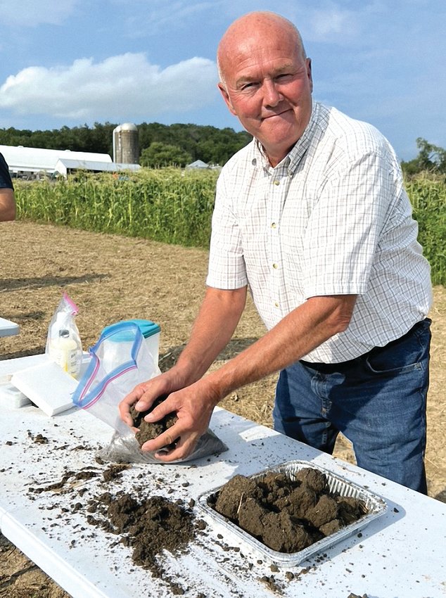 Local farmer Greg Thoren with soil samples from his farm as part of the demonstration following the seminar.