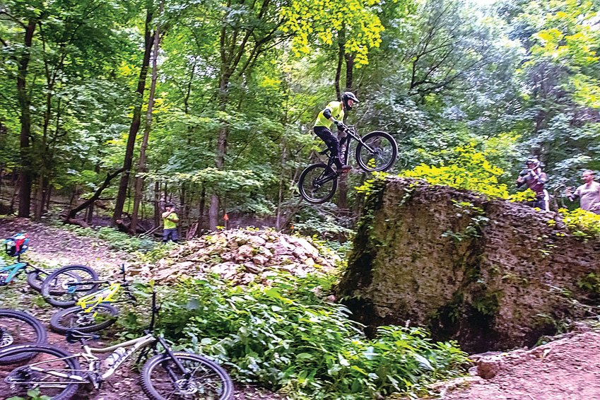 Wesley Muresan, Dubuque, Iowa, executes a perfect jump up to, over, and down the &ldquo;Gap,&rdquo; of the large boulders on the Black trail. &ldquo;Having a mountain bike trail system with such great use of the terrain is awesome,&rdquo; he said.