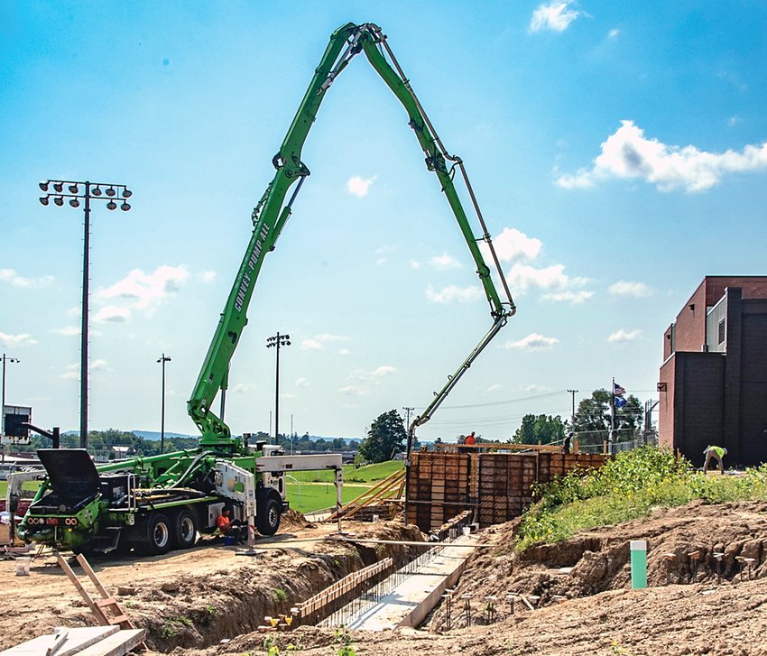 On Thursday Sept. 8, construction workers completed pouring concrete for a section of the foundation and wall sections with a concrete pump at the Galena Middle School.