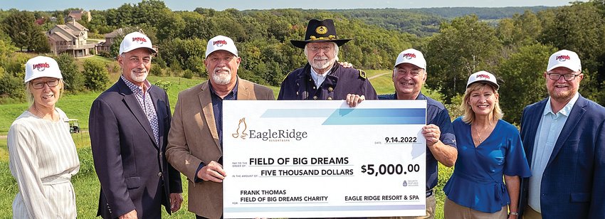 Last week, Eagle Ridge Resort &amp; Spa donated $5,000 to the Frank Thomas Foundation from its Legends golf outing held just before the Major League baseball game at the Field of Dreams site in Dyersville. Participating in the check passing are, from left, Jackie Richardson, Colin Sanderson, Keith Rahe, Phil Prud&rsquo;Homme portraying Gen. John Corson Smith, Mark Klausner, Katie Weil and Steve Geisz.