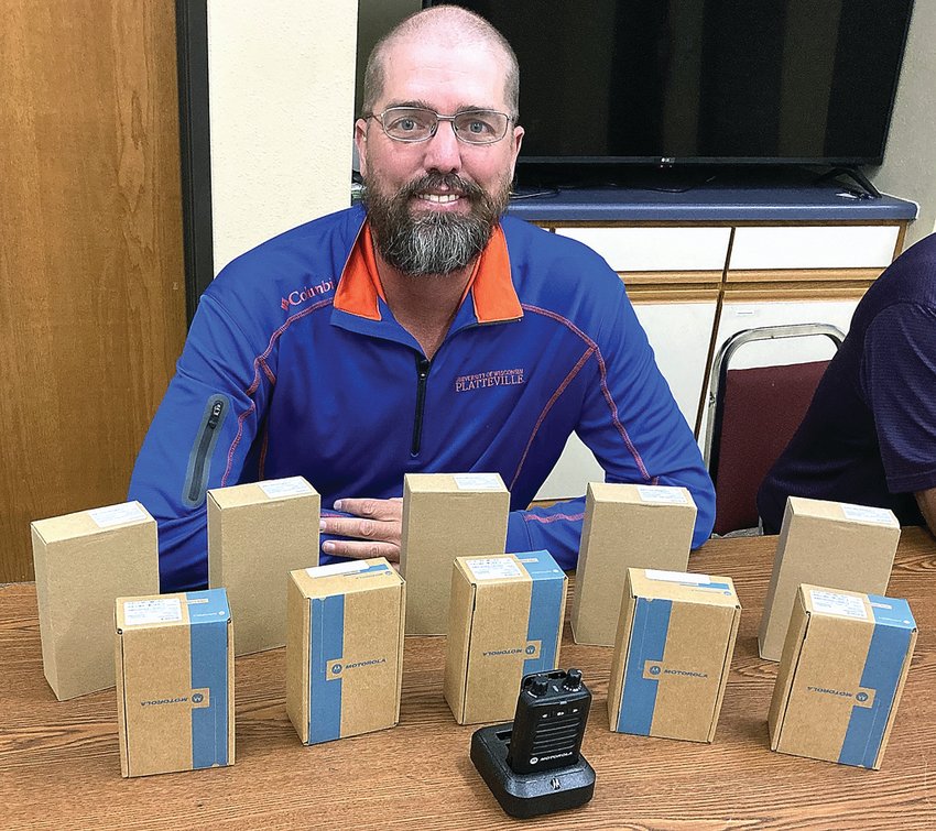 Jason Piddington, Hazel Green Area Rescue Squad service director, shows off the new pagers that have been recently purchased.