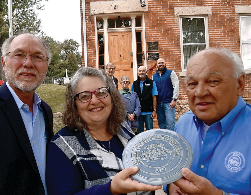 The hard and painstaking work which Daniel and Sandra Hurt have put into restoring the U.S. Grant Pre-Civil War House has been recognized by the city of Galena. On Wednesday, Oct. 5 the Hurts, front, from left, received the 2022 Galena Historic Preservation Award from Mayor Terry Renner with, back, from left, Craig Brown, Galena Historic Preservation Commission chair; Pam Bernstein and Marc McCoy, Galena City Council members; and Jonathon Miller, Galena zoning administrator. Renner told the couple that the city appreciates the care they have taken restoring the home and that it is an important community asset.