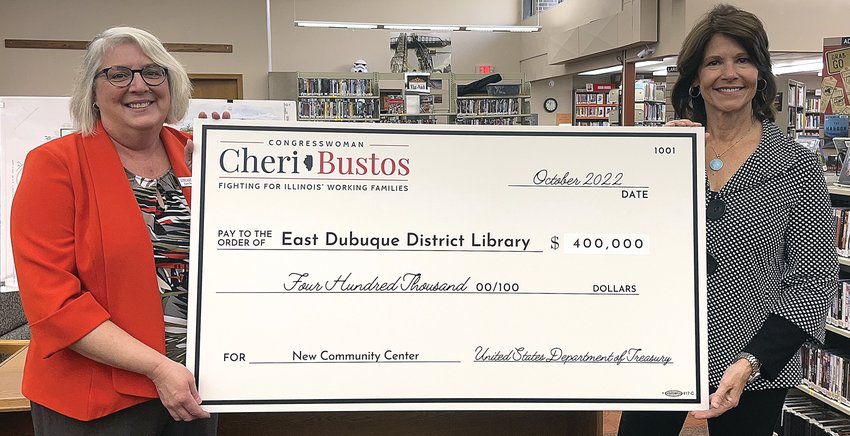 President of the East Dubuque District Library Foundation Vickie Middendorf and Congresswoman Cheri Bustos posed for a photo with a $400,000 check for the library expansion and renovation project.