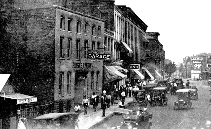 George Rust sold Fords back in the early days of automobiling. Can you identify where this is on Main Street?