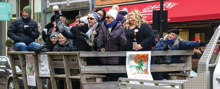 A festive crowd delivers wine to downtown Galena business during the 38th annual Nouveau celebration on Friday, Nov. 18, sponsored by Galena Cellars.