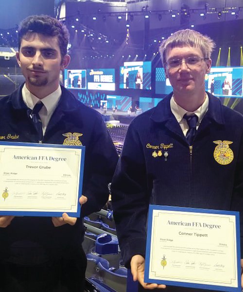 Trevor Grube and Conner Tippett were two of four alumni members of the River Ridge FFA Chapter who received their American FFA degrees at the National FFA Convention in Indianapolis, Ind. Also receiving their degrees were Kylie Hiher and Charlie Schnitzler. Less than one percent of all FFA members achieve this highest of distinctions. To qualify, students must have 50 hours of community service, documented earnings of a minimum of $10,000 with their Supervised Agriculture Experience project and a detailed record book of the time investment in their years-long project(s), which includes at least one year post high school.