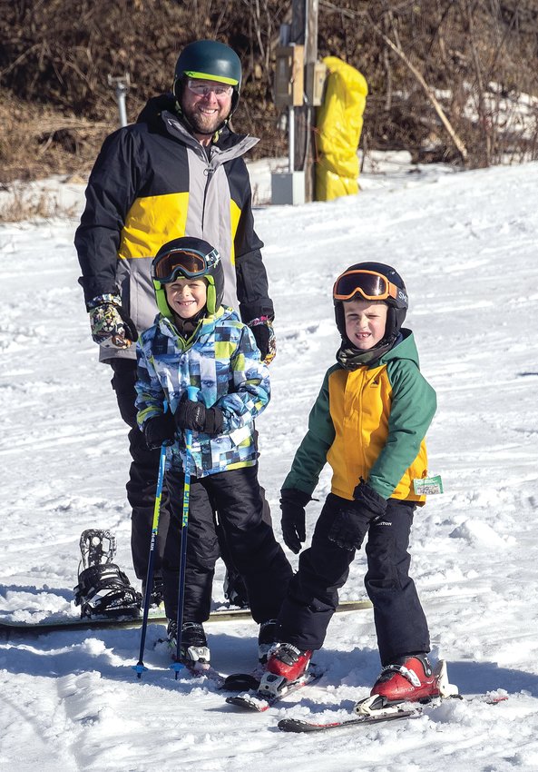 Chris Jackson and his son, Dylan, front left, as well as Bryce Huttenlocher, right, made their way out to Chestnut for a day fun on the slopes.