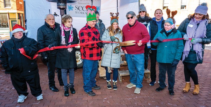 The Galena Area Chamber of Commerce held a ribbon cutting for the first annual Holidaze festival on Saturday, Dec. 3. Participating in the ribbon cutting were, from left, John Asta, Mayor Terry Renner, Denise Spielman, Ed Bochniak, Kyle Melaas, Christine Melaas, Dave Decker, Jennifer Montgomery, Justin Helle, Teri Nelson and Briane Van Hemert.