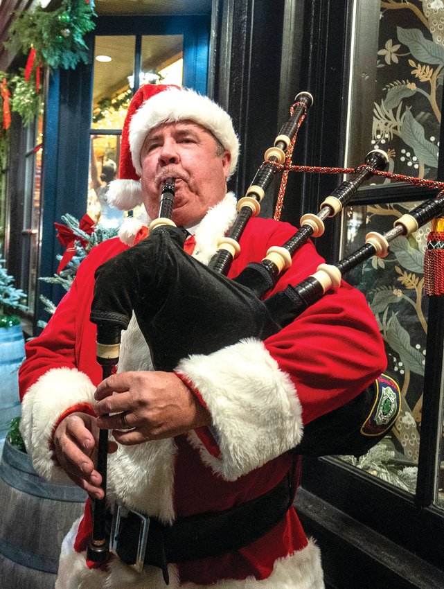 Bill Spivey plays the bagpipes outside Galena Cellars.