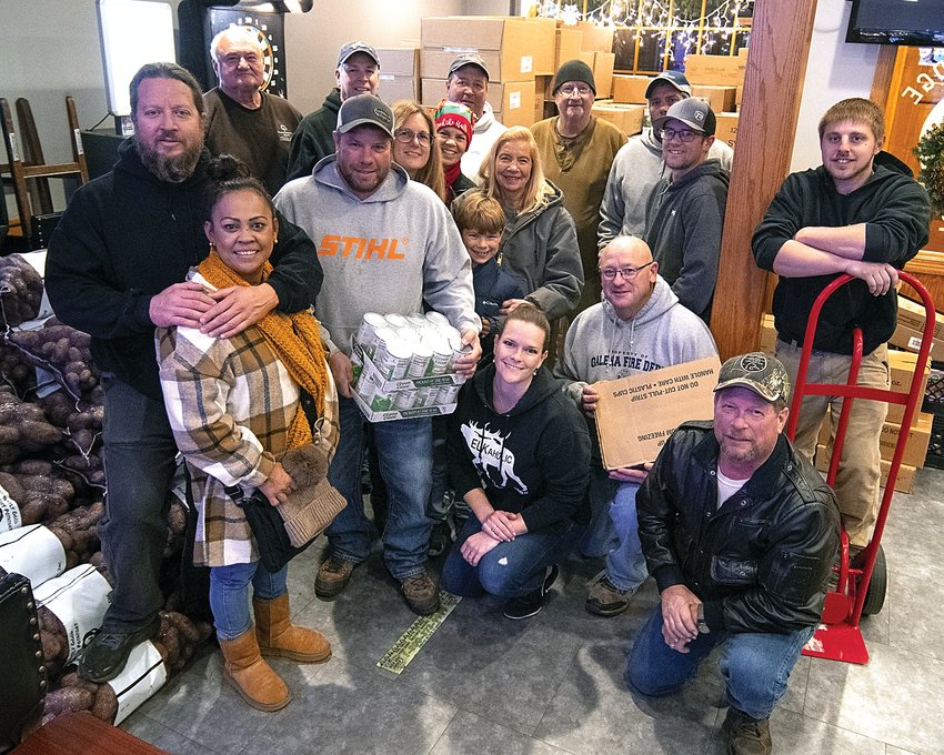 Helping with food collection on Thursday, Dec. 8 for the Elks food basket program are, back, from right, Scott Price, Marty Soat, Scott Reinke, Thom Mercker, Wally Turpin; middle, from left, Todd O&rsquo;Brien, Maria Atibagos, Bo Richardson, Casey Richardson, Julie Soat, Chandler Richardson, Mary Jo Reinke, Luke Einsweiler, Jack Huber; and kneeling, from left, Amber Greene, Wayne Moyer and Jeff Klein.
