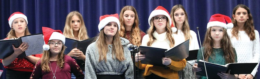 River Ridge held its holiday concert on Dec. 14. Members of the seventh- and eighth-grade choir include, back, from left: Faith Morhardt, Savannah Banley, Ellie Rife, Breck Roche, Bria Andrade; and front, from left, Allie Karberg, Jordan Ballard, Clara Gerlich and Ashlyn Edens.