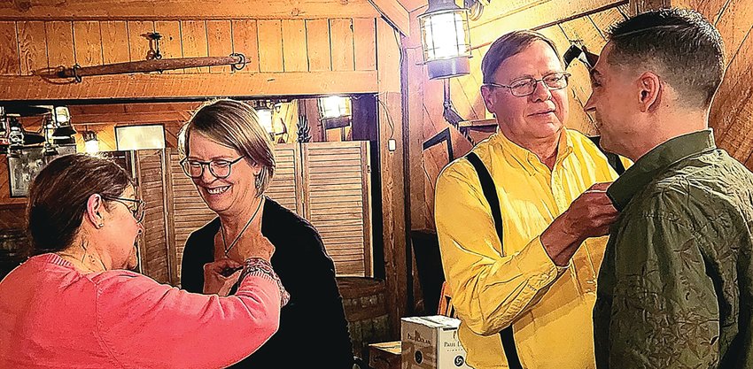 The Galena Lions Club initiated two members at its Nov. 10 meeting. From left, Kathleen Schuler, second vice president, pins Catherine Kutka while Chet Schuler pins David Hagens. Earlier in the year the two couples struck up a conversation on the Galena River Trail. As a result, Kutka and Hagens began attending Galena Oktoberfest committee meetings and in October, they joined the club. The Galena Lions Club membership is open year-round to adults. Call 815-331-0180 for more information.