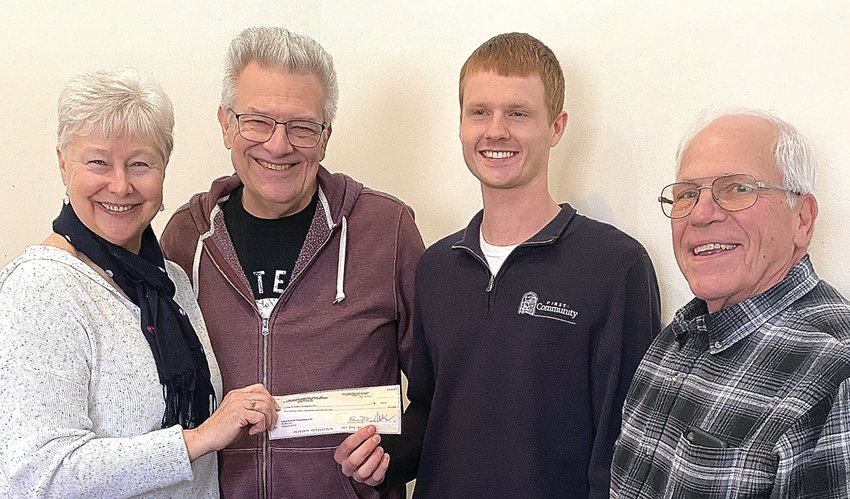 From left, JoAnne and Mike Muzzey present a check for $599 to Austin Gerlich, Galena Kiwanis president; and Ty Cocagne, treasurer. The Muzzeys&rsquo; home was on the holiday home tour in The Galena Territory. A portion of the profits benefit local non-profit organizations. The Muzzeys chose Galena Kiwanis.