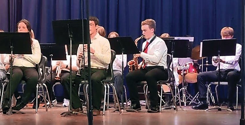 East Dubuque schools held its holiday music concert on Thursday, Dec. 8. Members of the high school band performing are, from left, Joelle Haven, James Degenhardt, Joey Delaney and Wil Quinn.