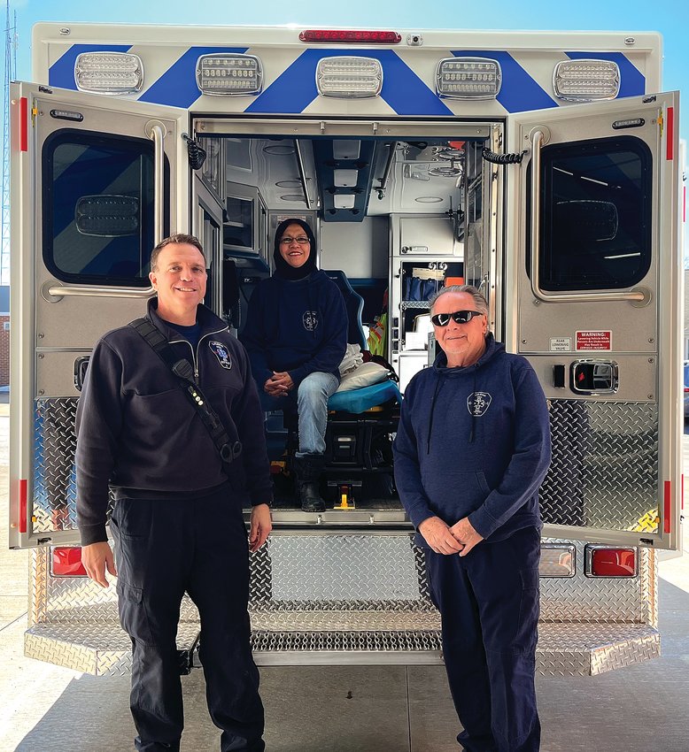EMT Gabriel King, left, EMT Aishah Abdul-Aziz, center, and EMS Coordinator Bill Bingham, right, inspect the new ambulances bay which is designed to offer greater patient comfort and EMT efficiency.