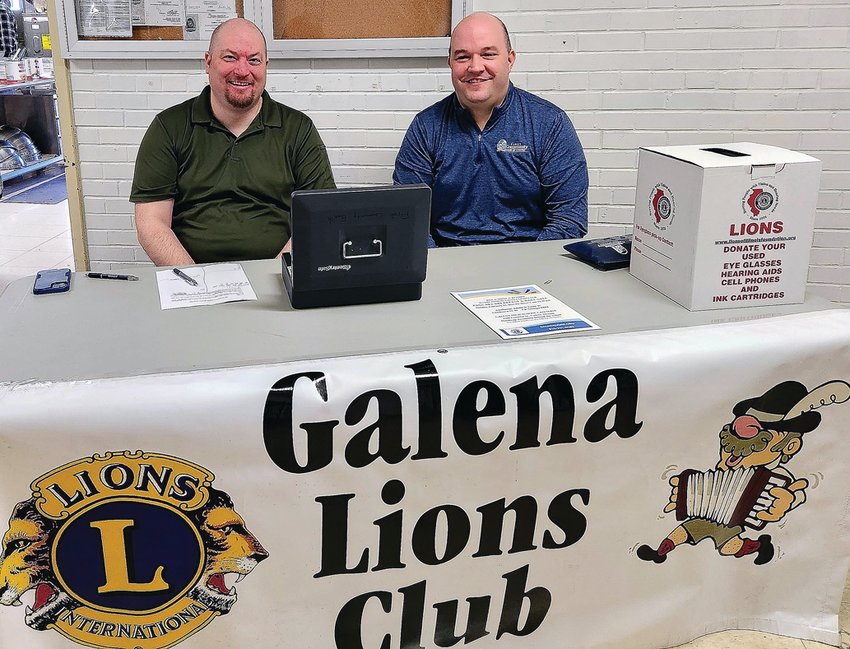 Working the front table are Galena Lions Club members Scott Roberts and Nathan Vondra.